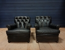 style Pair of black leather armchairs