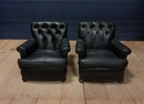 style Pair of black leather armchairs