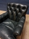 style Pair of black leather armchairs